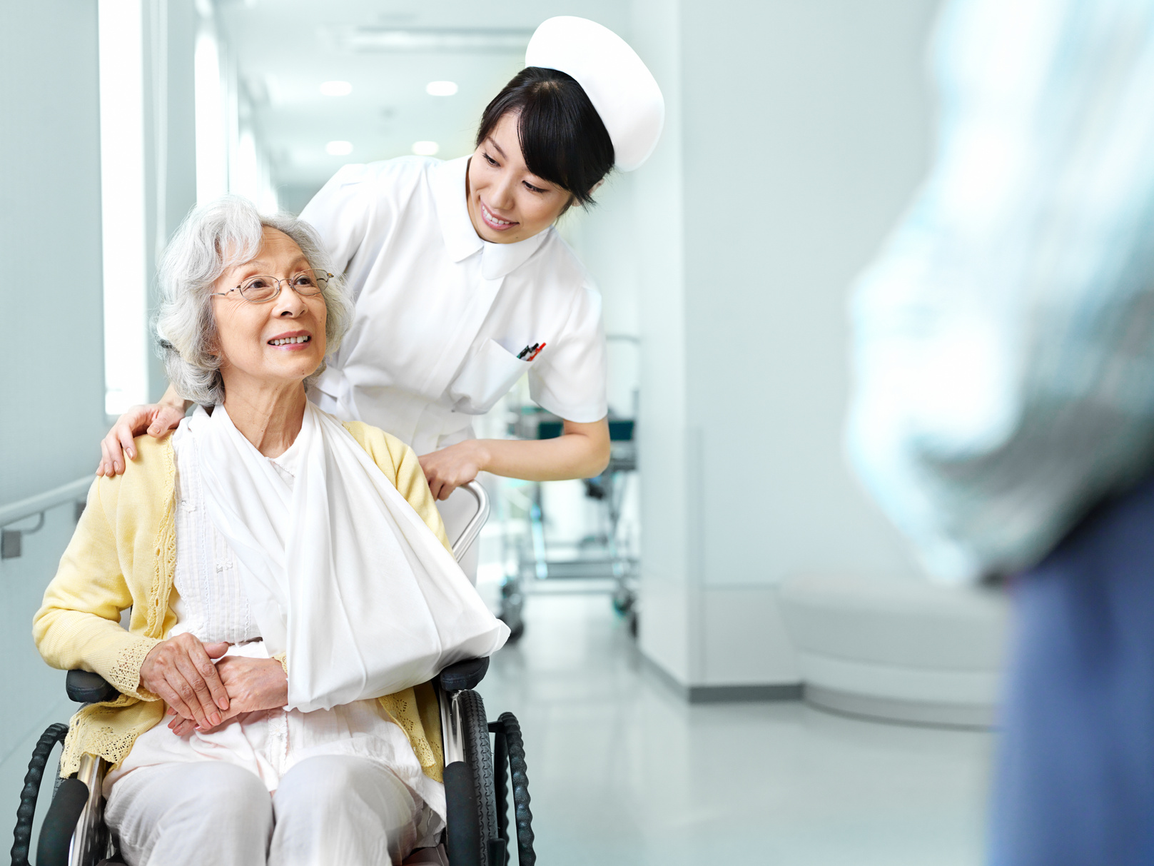 Nurse assisting patient